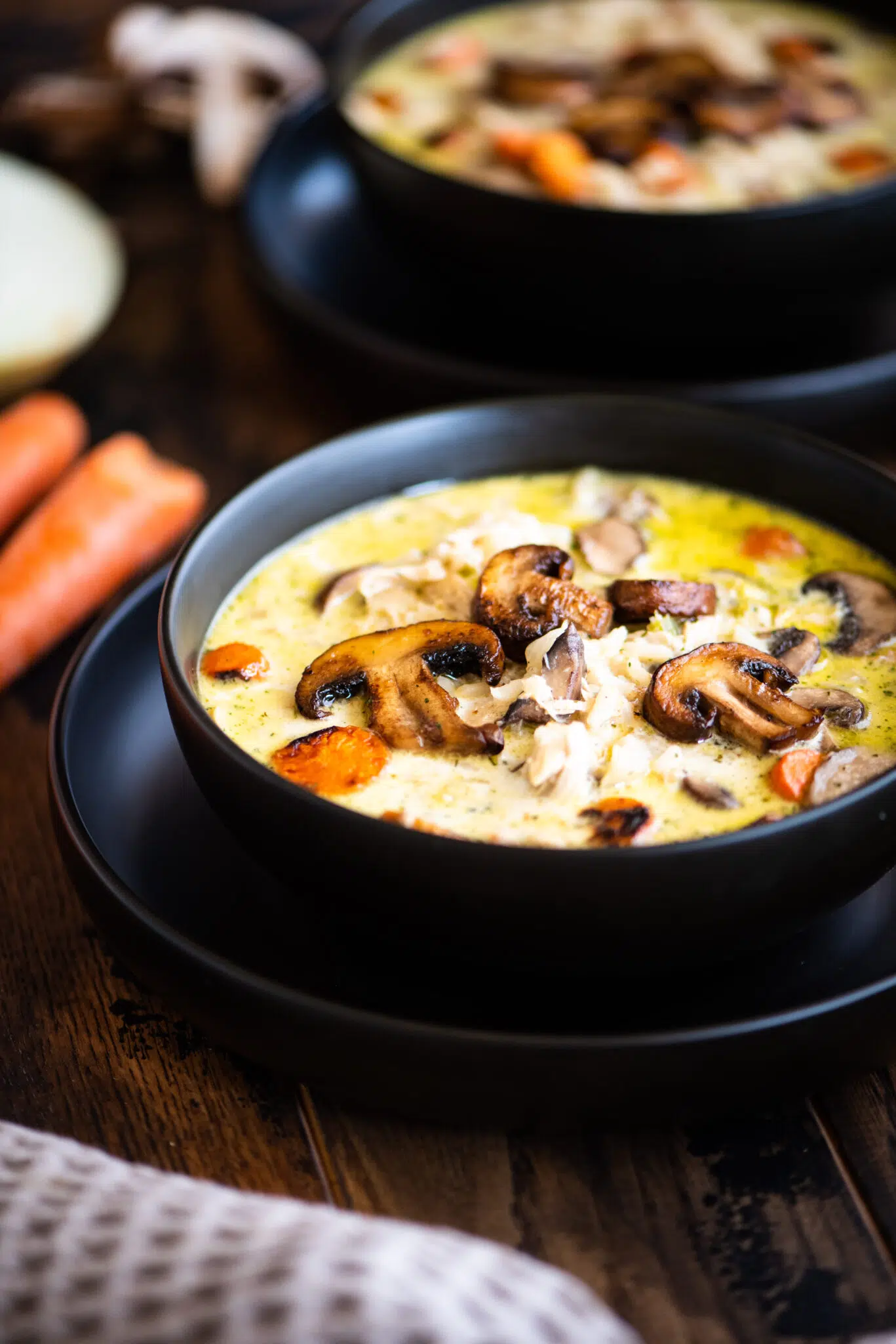 Two bowls of creamy chicken and rice soup
